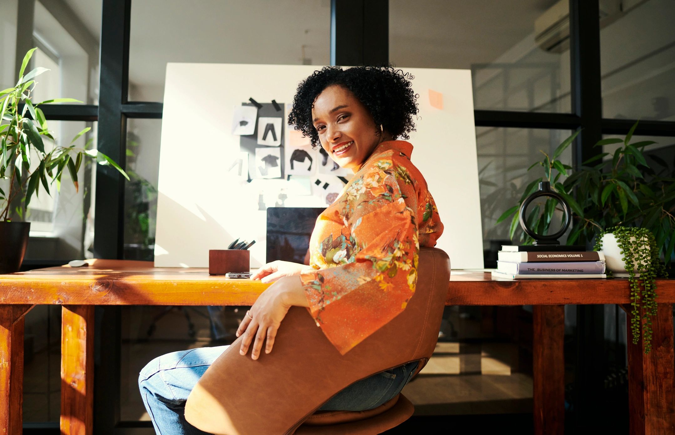 Professional woman seated for a polished headshot session