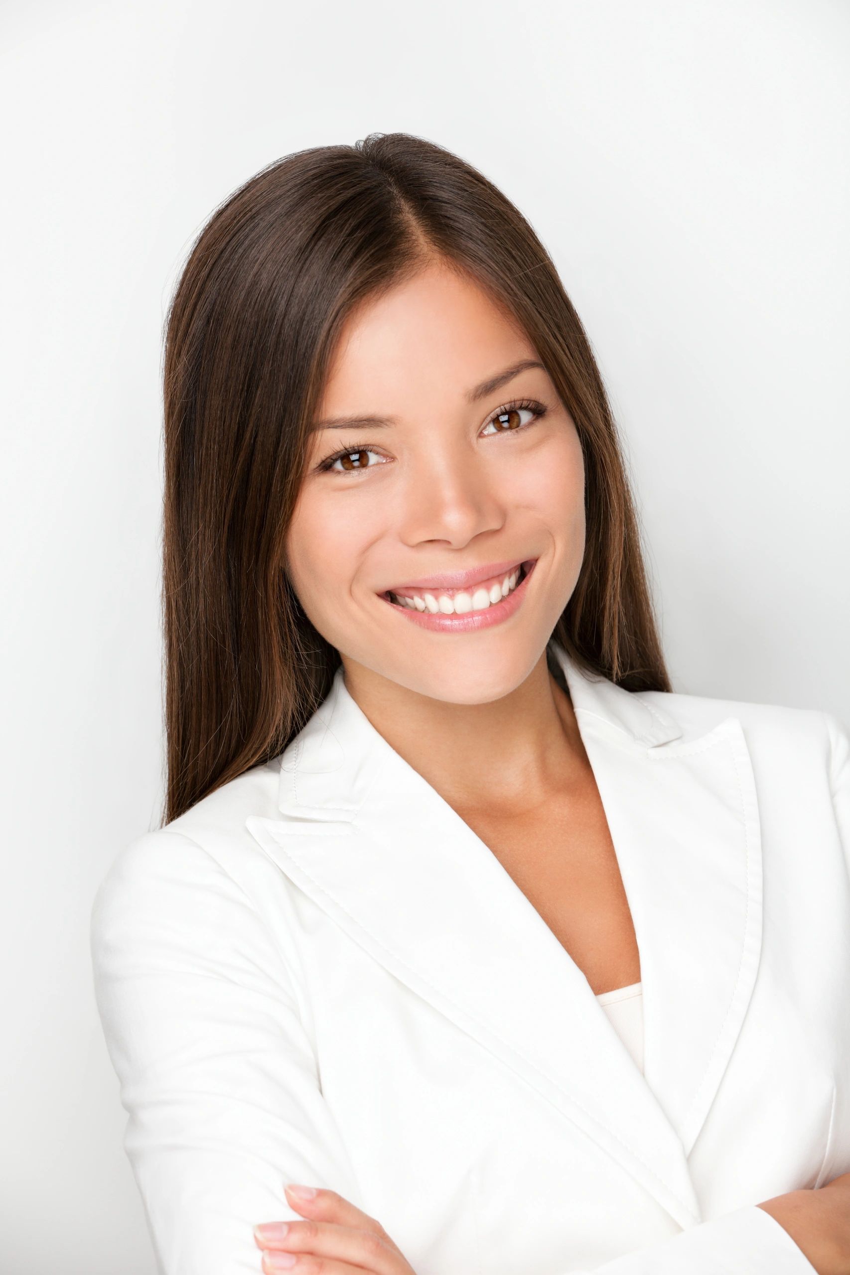 Young female professional smiling in a studio headshot