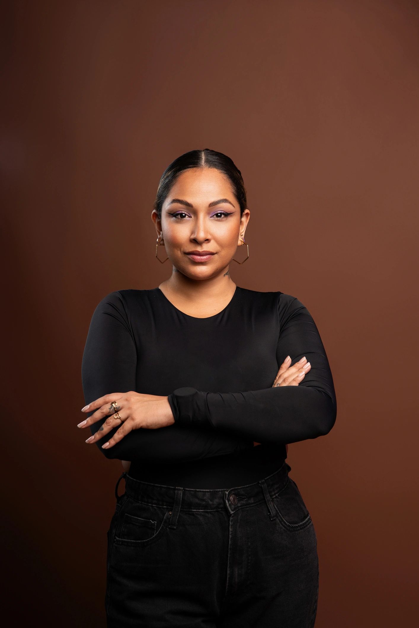 Professional studio headshot of a confident woman