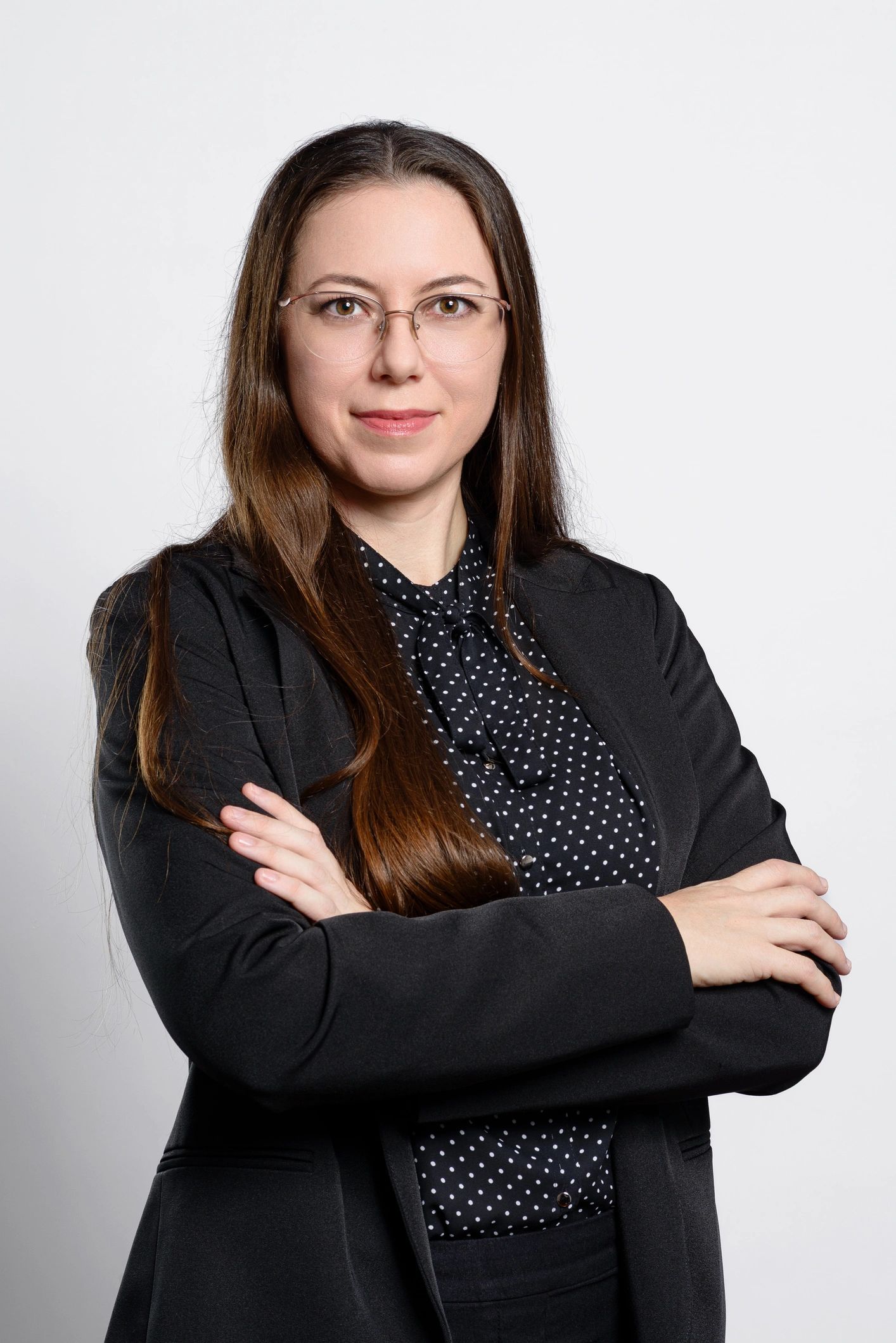 Professional portrait of a young woman with glasses